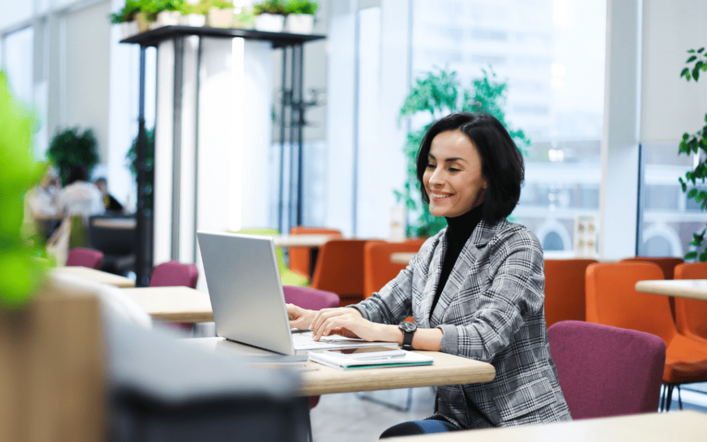 A content writer sitting in a café to write a copy for a client 